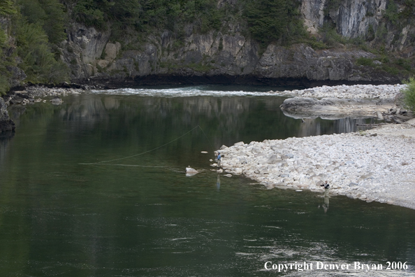 Flyfishermen casting from shore.