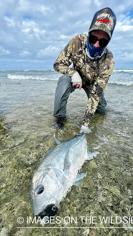 Flyfisherman with giant trevally.