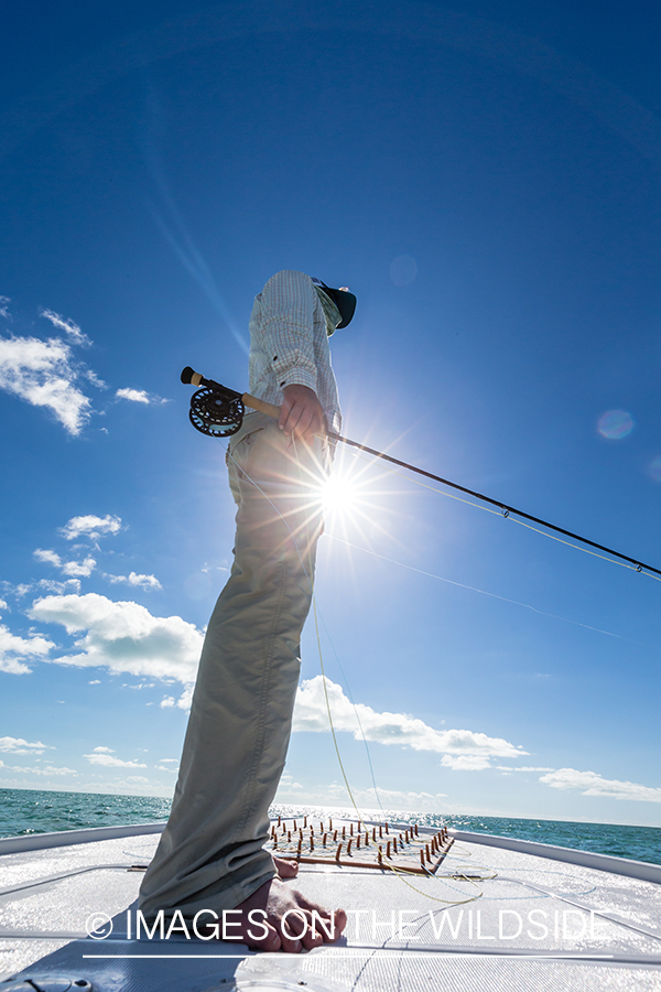 Flyfisherman on boat.