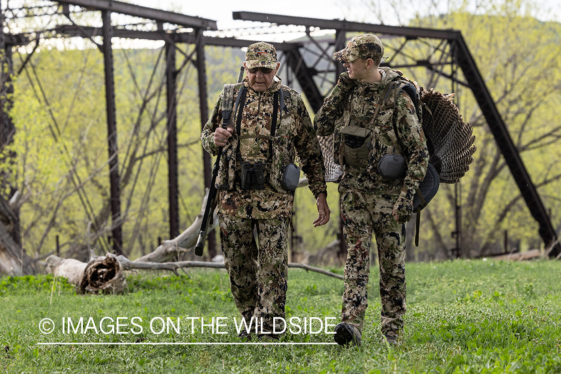 Hunters with bagged turkey.