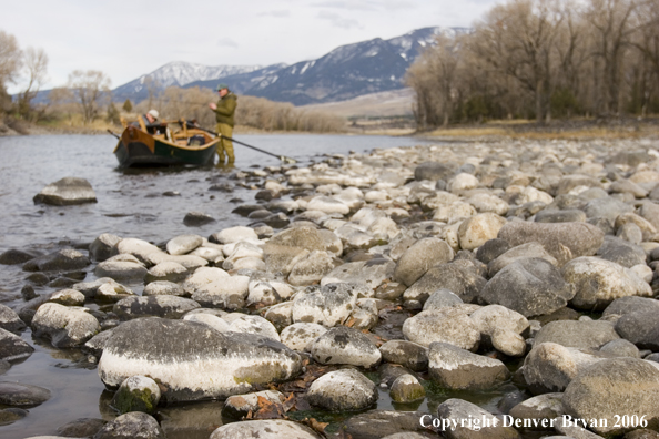 Drift boat on river.