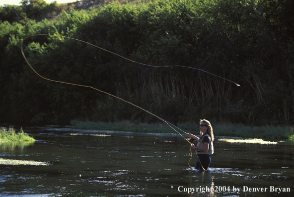 Woman flyfishing. 