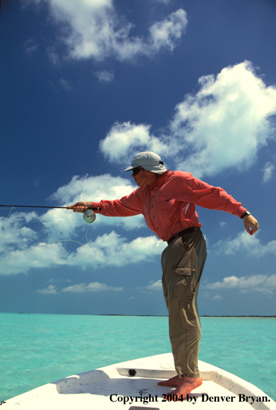 Saltwater flyfisherman casting from boat.