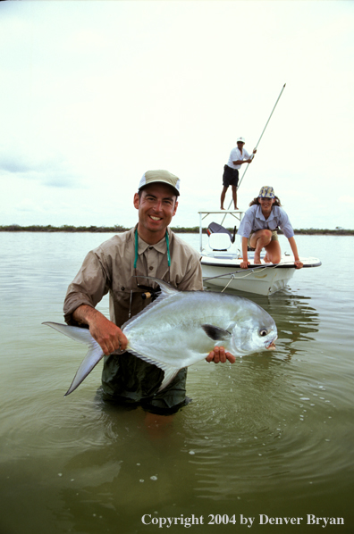 Saltwater flyfisherman holding permit.