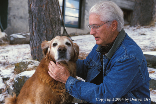 Man with golden Retriever.