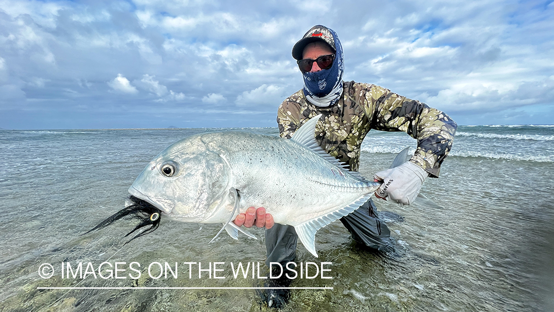 Flyfisherman with giant trevally.