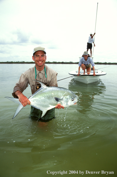 Saltwater flyfisherman holding permit.