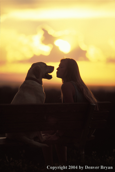 Woman with yellow Labrador Retriever