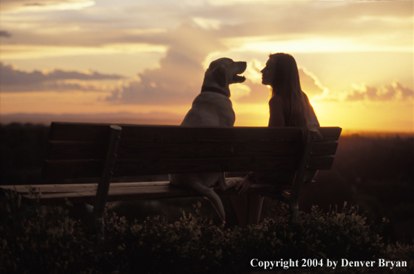 Woman with yellow Labrador Retriever