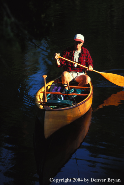 Flyfishermen in canoe.