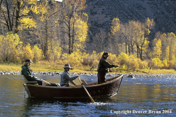 Fly fisherman fishing from driftboat.