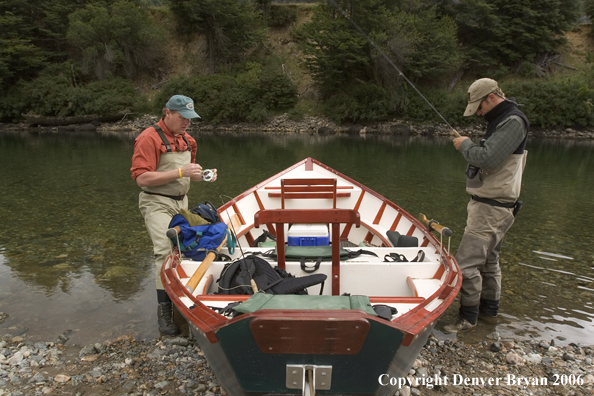 Flyfishermen at driftboat.