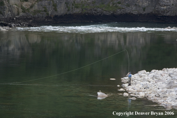 Flyfisherman casting from shore.