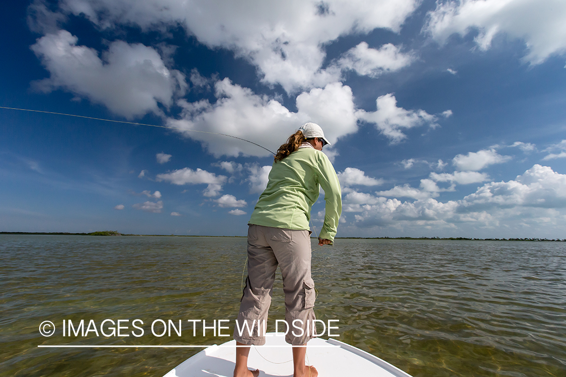 Flyfishing woman in flats.