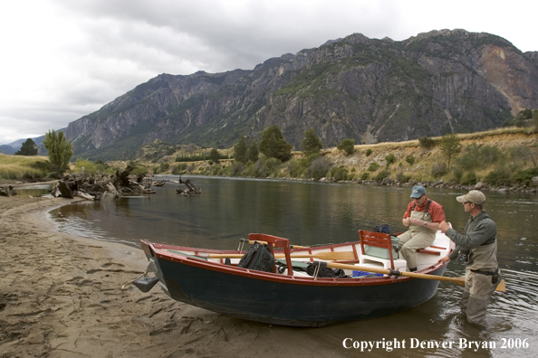 Flyfishermen at driftboat.