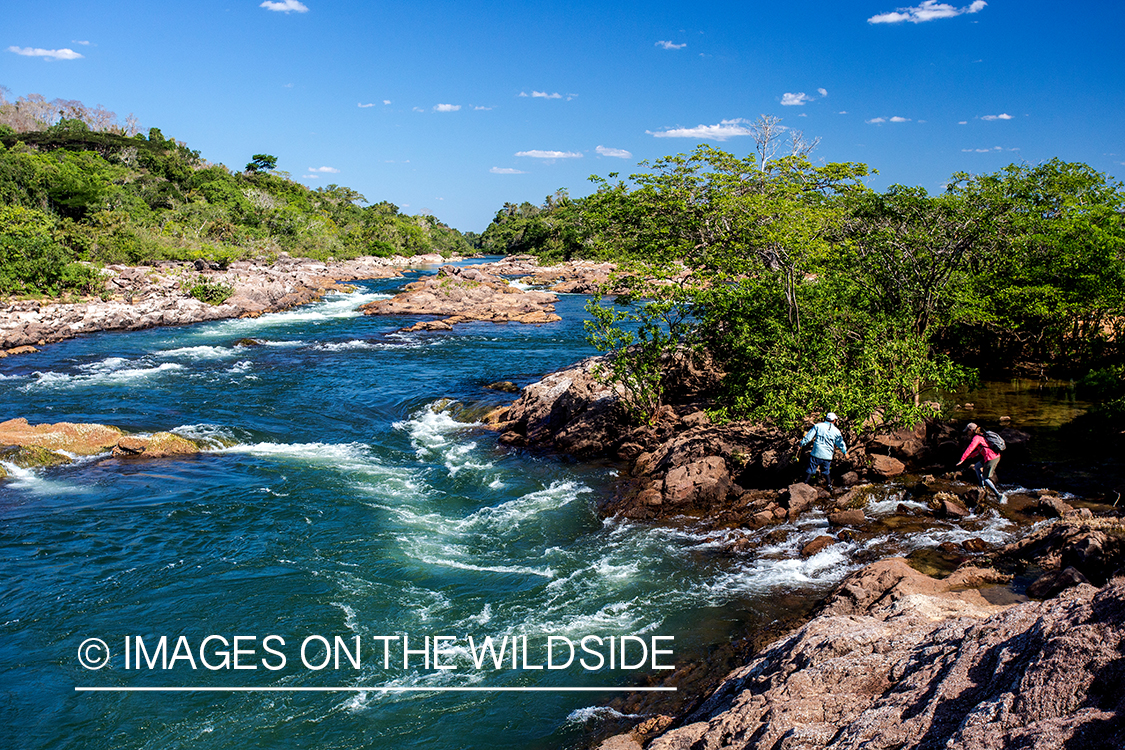 Flyfishermen along river in Kendjam region, Brazil.