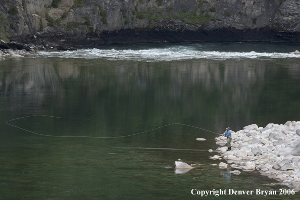 Flyfisherman casting from shore.