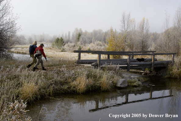 Flyfishermen walking to river.