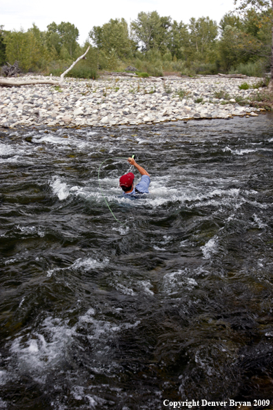 Flyfisherman caught in rapids