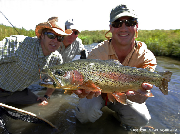 Flyfishermen with nice rainbow trout