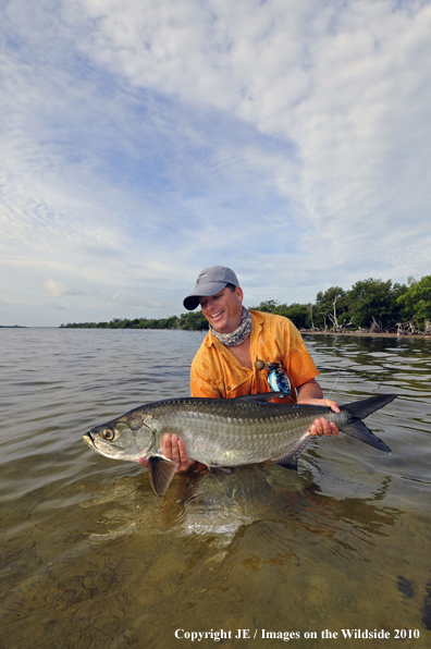 Saltwater Flyfisherman with nice Tarpon catch