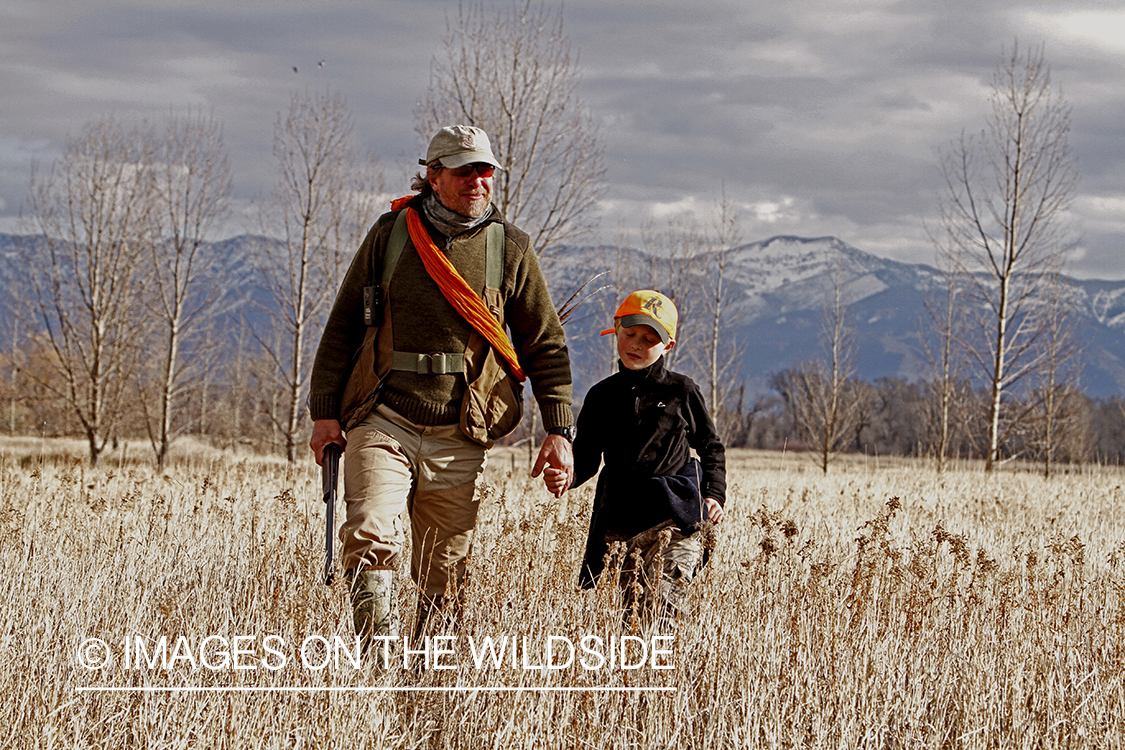 Father and son pheasant hunting. 