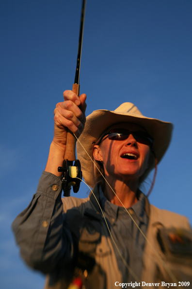 Woman freshwater flyfishing