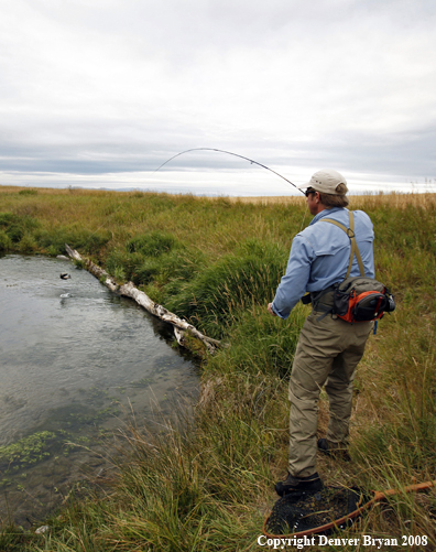 Flyfisherman with fish on