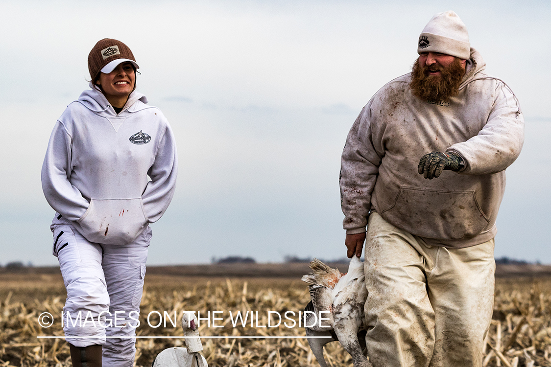 Hunters with bagged goose. 
