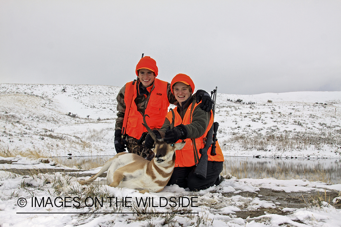 Young hunters with bagged pronghorn antelope. 