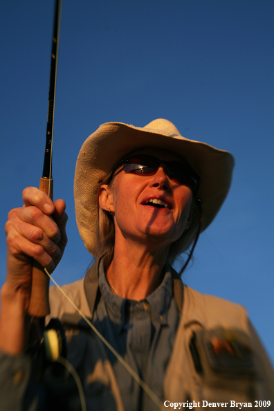 Woman freshwater flyfishing