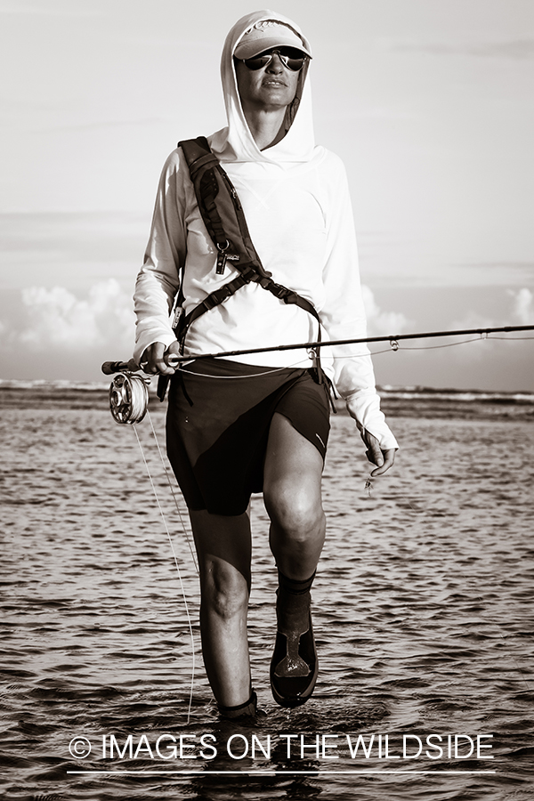 Flyfishing woman in flats.