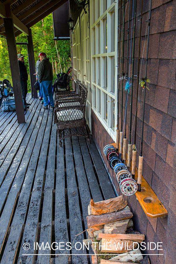 Flyfishermen at lodge with flyfishing rods.