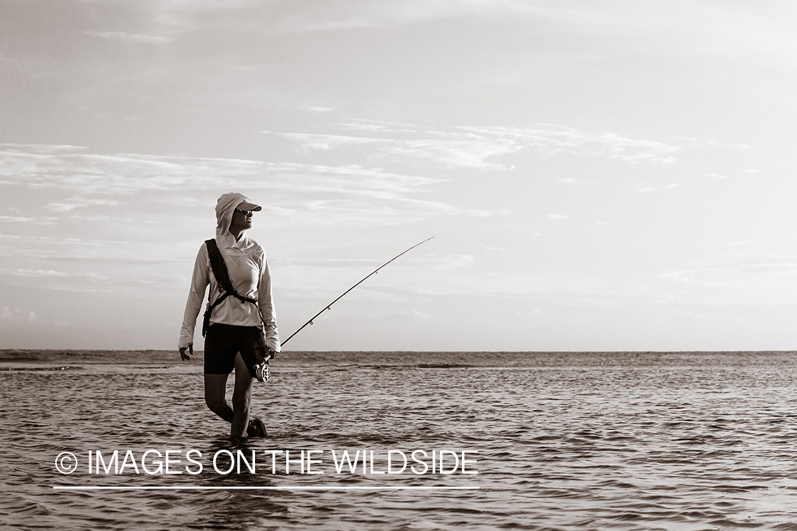 Flyfishing woman in flats.