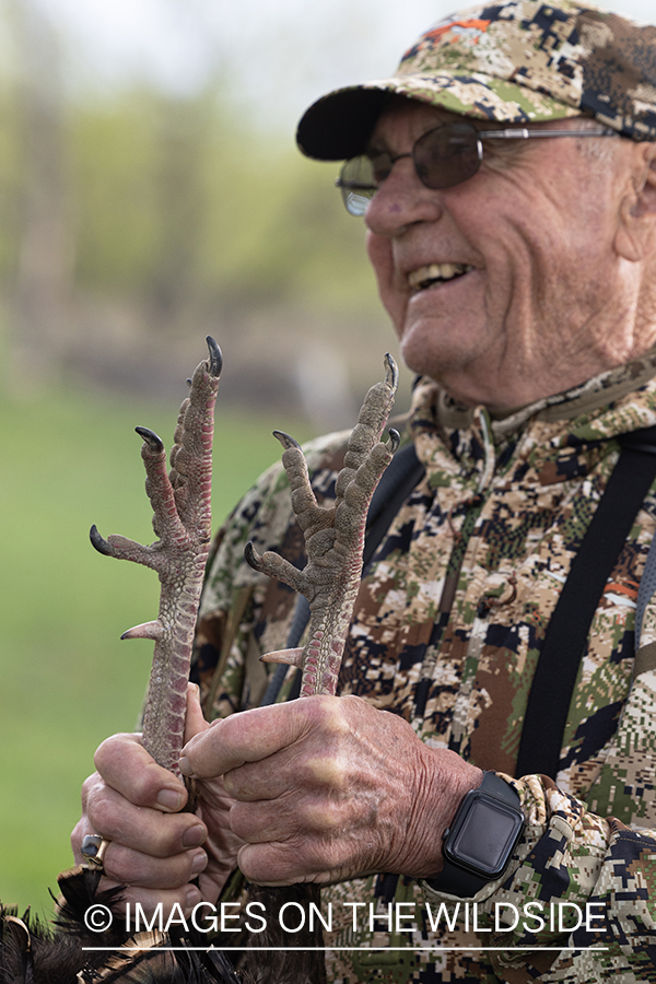 Hunter with bagged turkey.