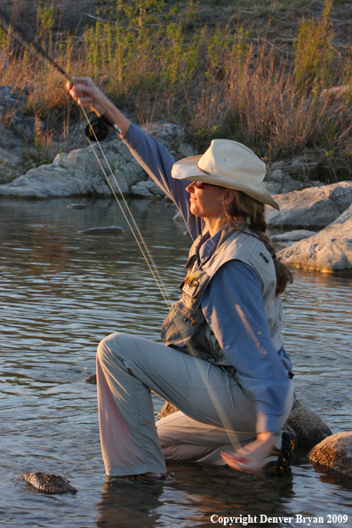 Woman freshwater flyfishing