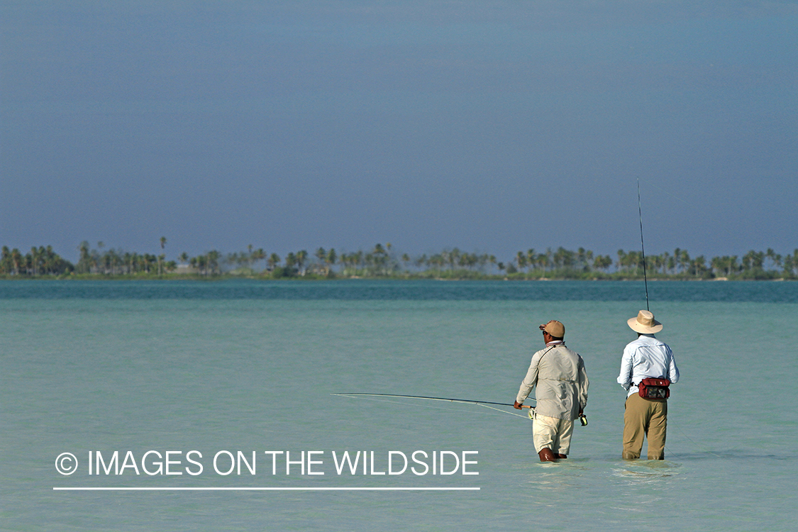 Saltwater flyfisherman with guide, Christmas Island.