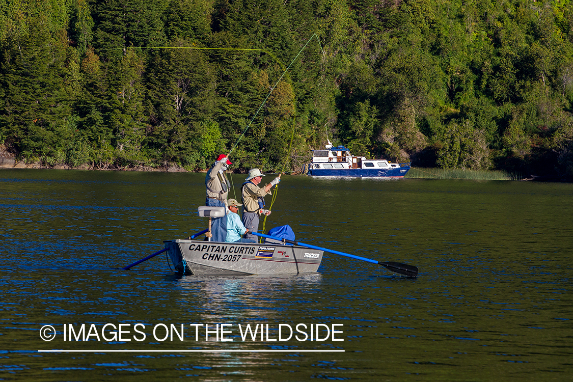 Flyfishermen casting from boat.