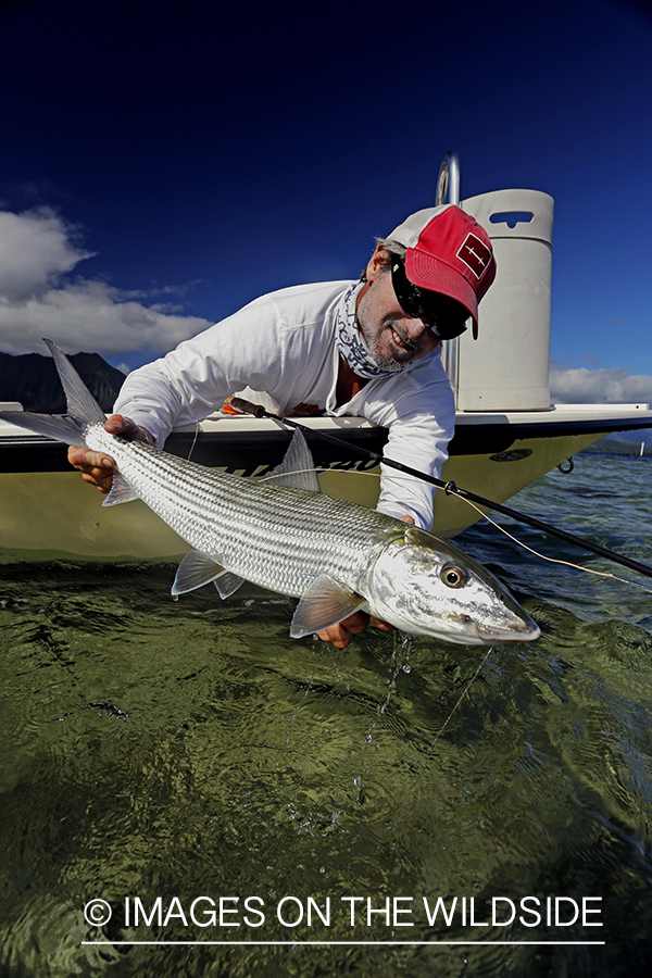 Saltwater flyfisherman with bonefish. 