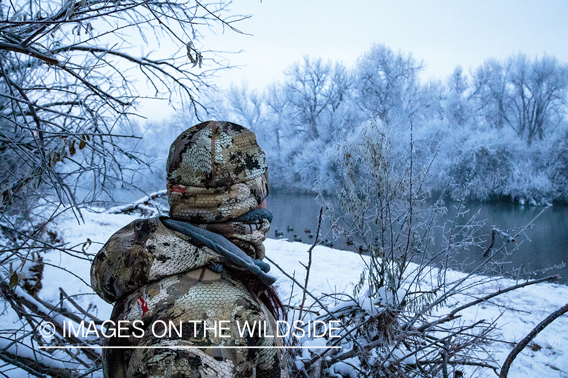 Hunter overlooking duck decoys.