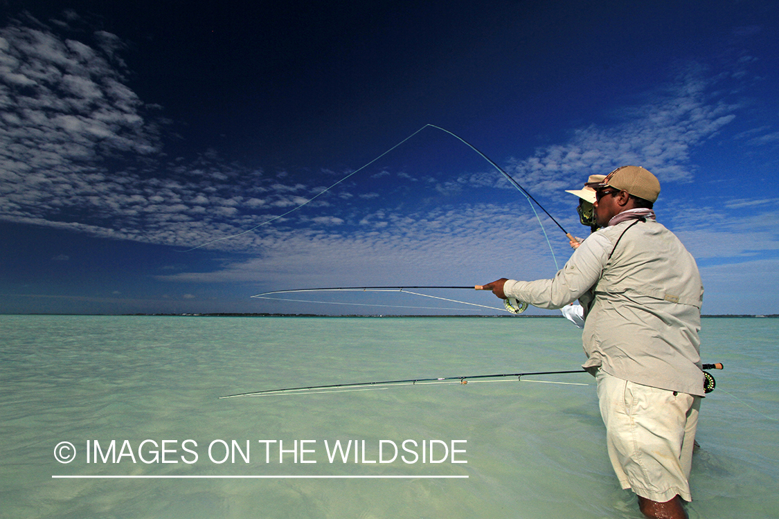 Saltwater flyfisherman with guide, Christmas Island.