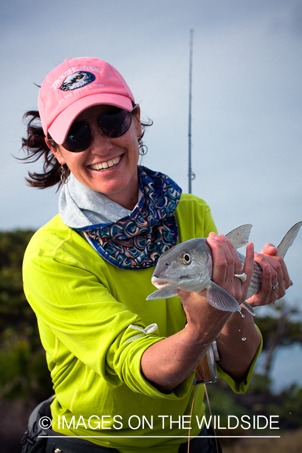 Flyfishing woman with bonefish.