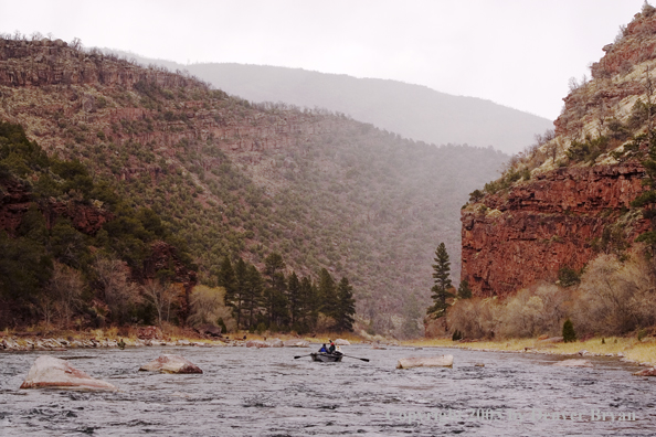 Flyfishermen fishing Green River from drift boat.