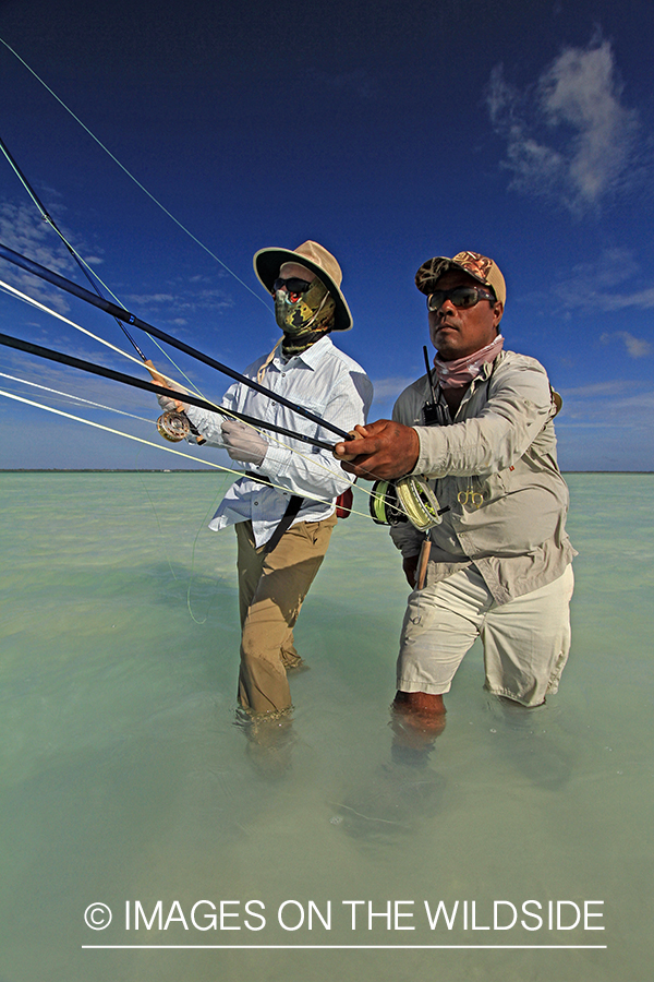 Saltwater flyfisherman with guide, Christmas Island.