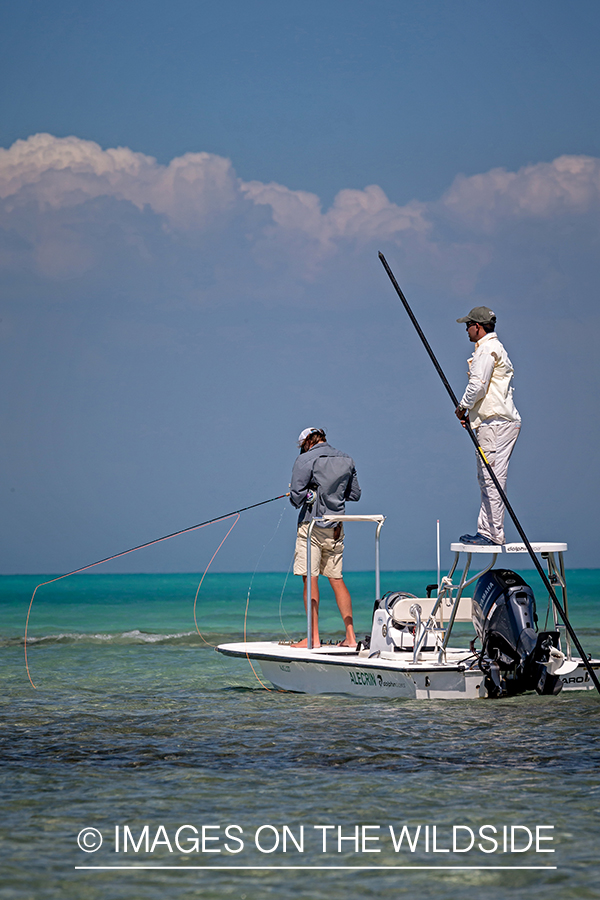 Flyfisherman on flats boat with guide.