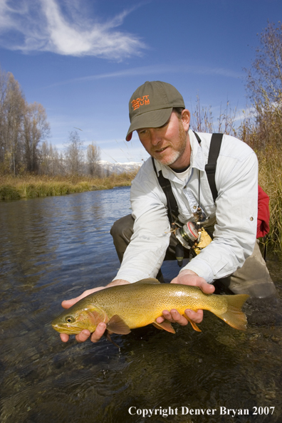 Flyfisherman with Snake River cutthroat trout.