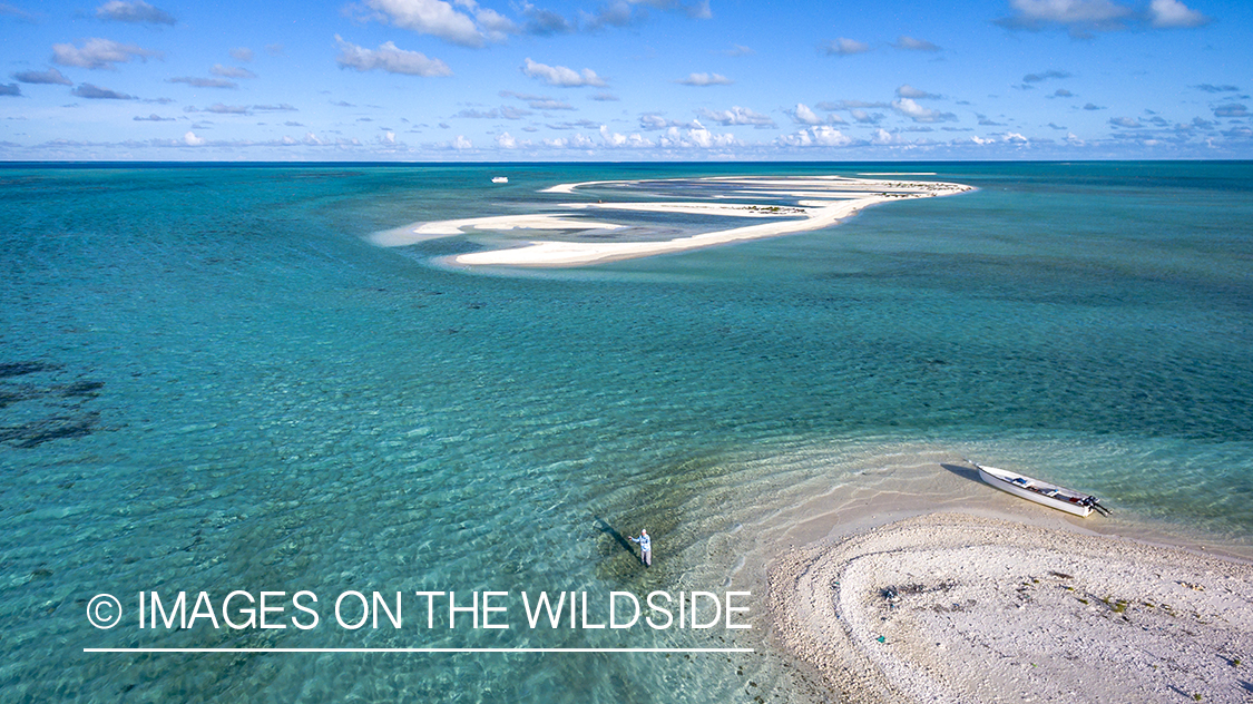 Drone aerial shot of fisherman on St. Brandon's Atoll Flats.