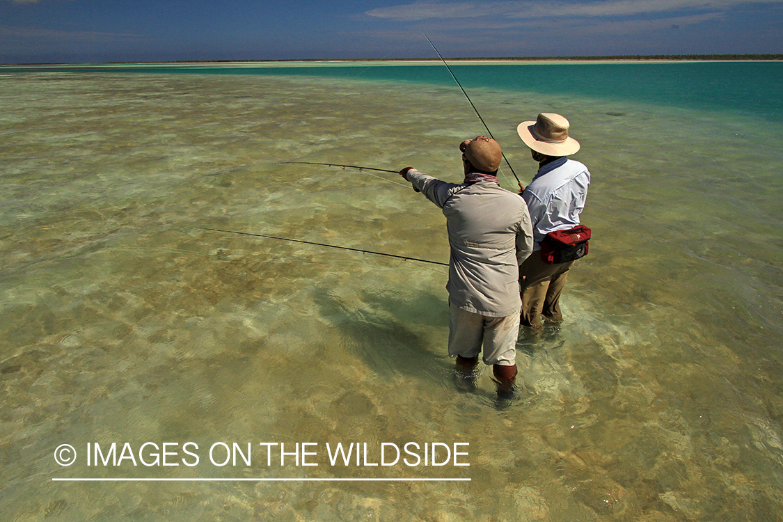 Saltwater flyfisherman with guide, Christmas Island.