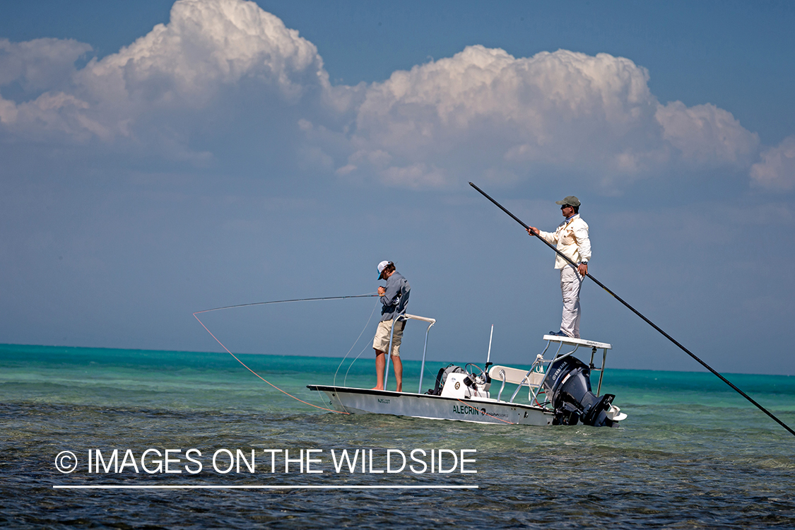 Flyfisherman on flats boat with guide.