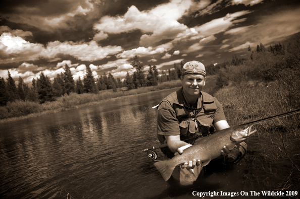 Flyfisherman with large trout.